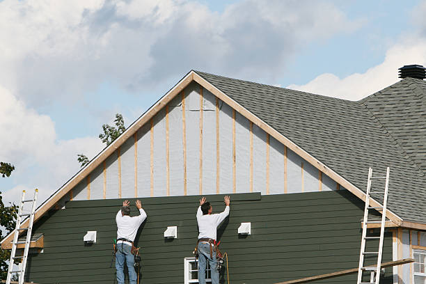 Professional Siding Replacement technician working in Chester, WV